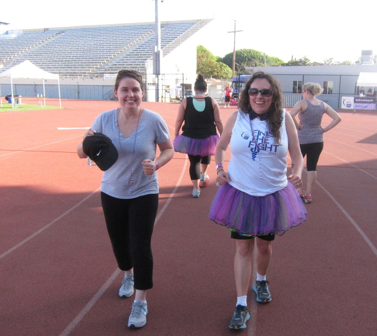 Katie Devine, right, and Jackie Morrison, decided to take a lap backwards late Saturday afternoon during this weekend’s marathon fundraising walk Relay for Life.. (Photos by Saul Rubin)