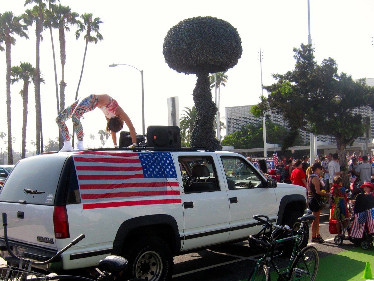 Juliana Payson practices a backbend atop the Muscle Beach parade vehicle Friday before the start of the 8th annual Santa Monica Fourth of July Parade. (Photo by Saul Rubin)