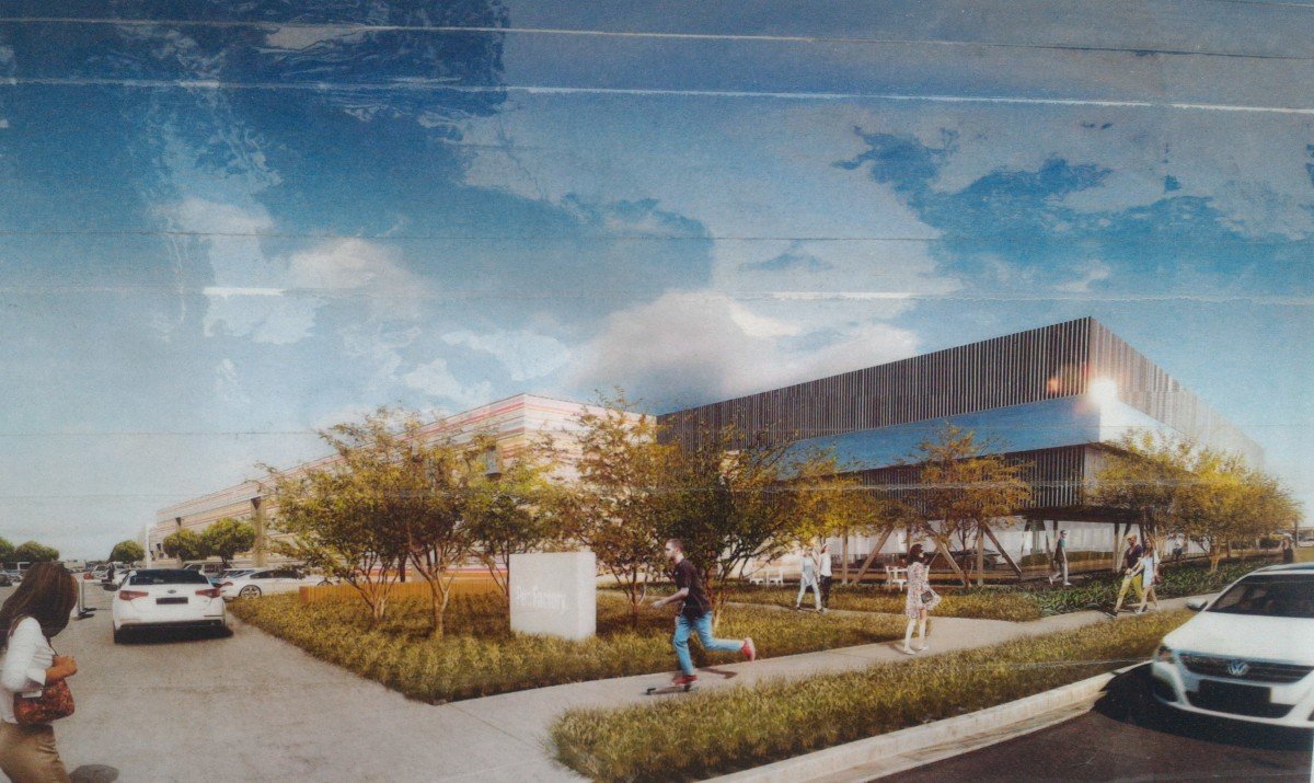 A rendering of the 26th Street entrance to the pending office park slated for the Papermate site. This rendering is posted on the fence at the site.