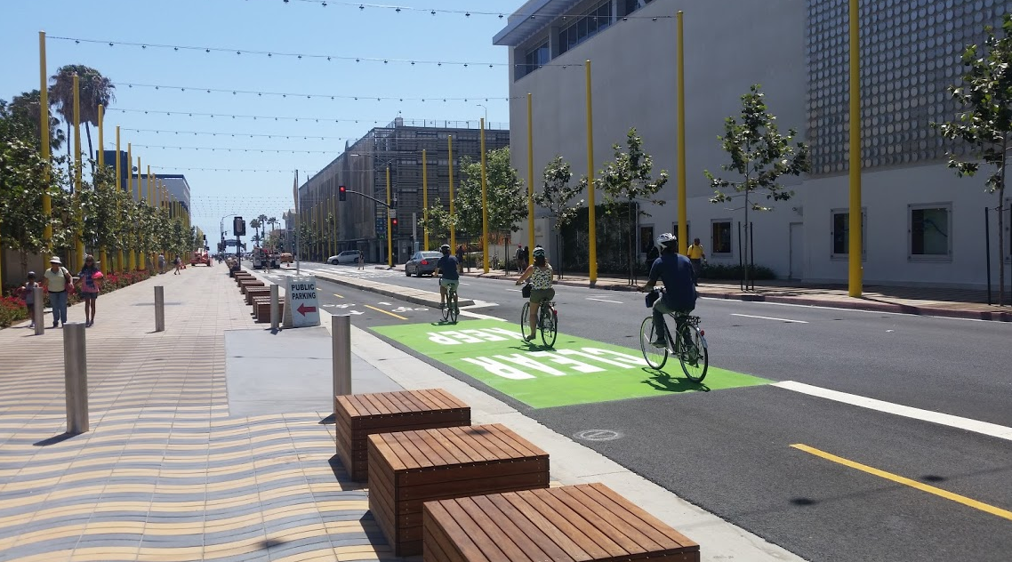 Bicyclists head west toward the Pier. The green box is present to warn of a potential conflict with vehicles entering the Sears parking lot.