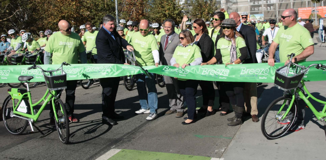 Councilmembers Kevin McKeown, Ted Winterer, and Gleam Davis join Assemblymember Richard Bloom to cut the ribbon in November, officially opening the Breeze Bike Share system to the public. Photo via city of Santa Monica.