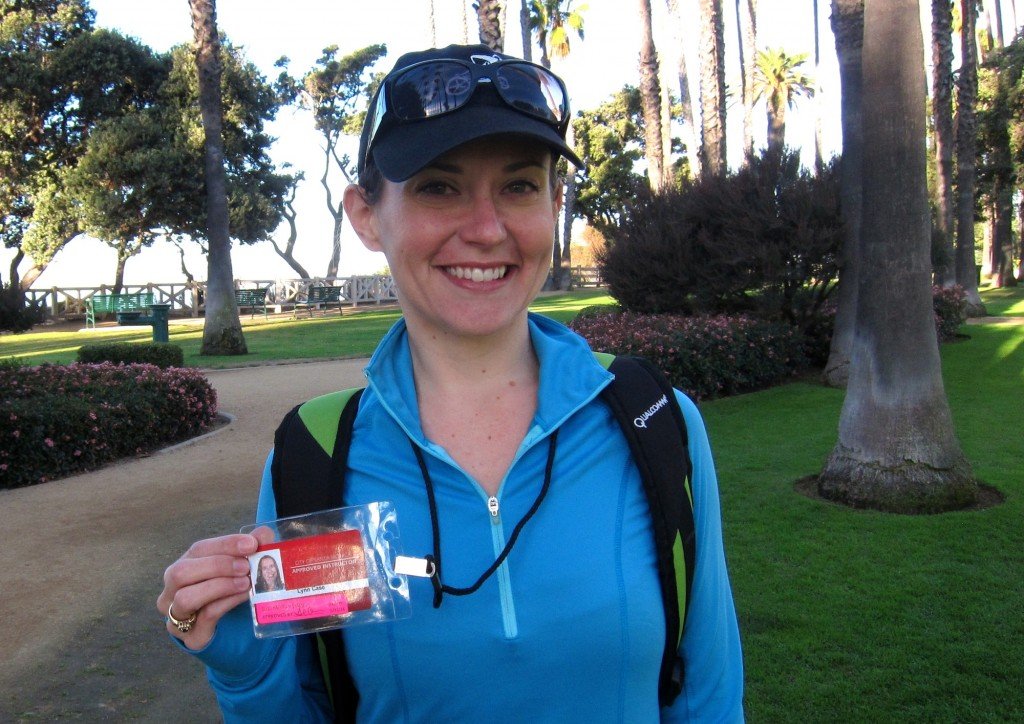 Trainer Lynn Case displays the city-issued identification badge that allows her to teach group classes in Palisades Park in Santa Monica. Photo: Saul Rubin