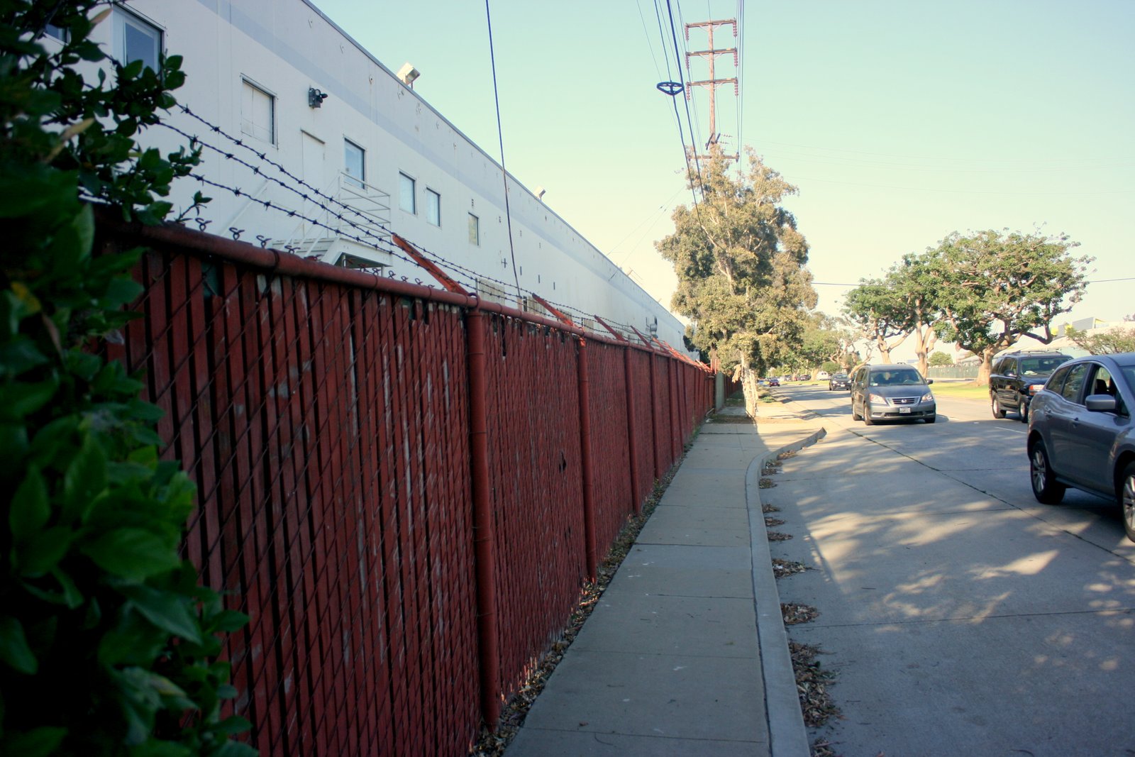 On the south side of the former Papermate site, a barbed-wire fence lines Olympic Boulevard.