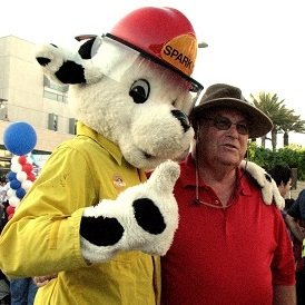 Santa Monica Councilmember Bob Holbrook poses with the Santa Monica Fire Department's mascot, Sparky. (photo by Jason Islas)